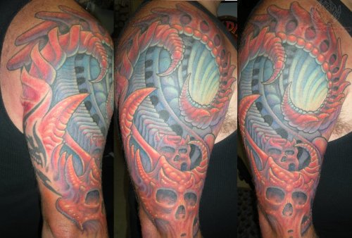 Colored Ink Mechanical Tattoo On Shoulder
