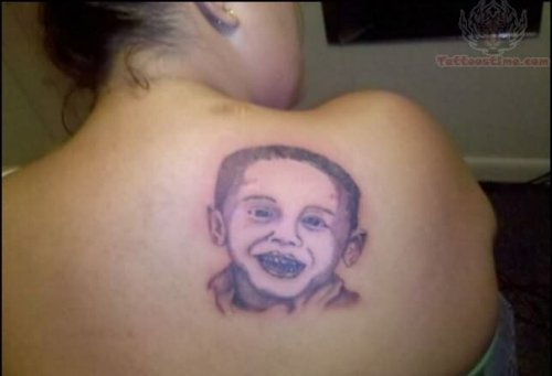 Memorial Face Tattoo on Back