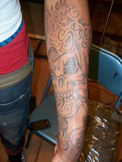 Grey Ink Money Tattoo On Man Left Sleeve