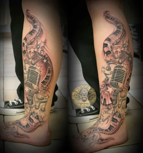 Music Piano Keys And Money Tattoo On Leg