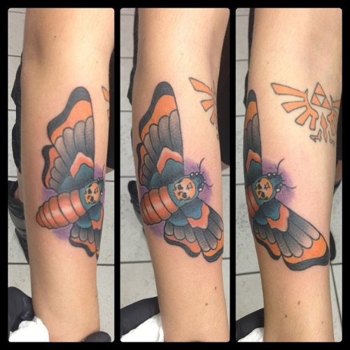 Zelda Crest And Colored Moth Tattoo