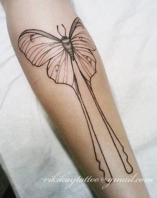 Lina Outline Moth Tattoo On Arm