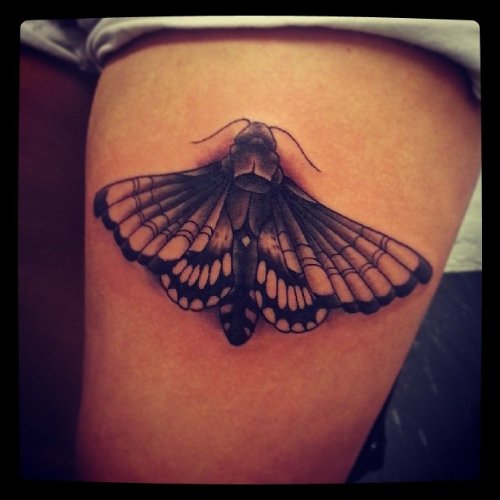 Grey Ink Thigh Moth Tattoo