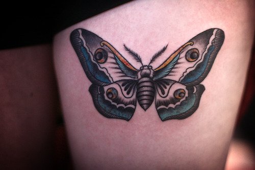Blue ink Moth Tattoo On Left Thigh