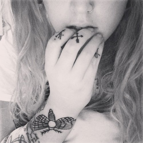 Grey ink Moth Tattoo On Wrist