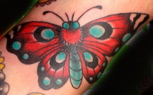 Red And Blue Ink Moth Tattoo
