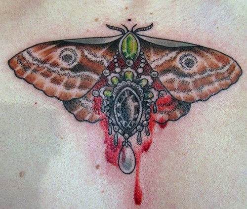 Bleeding Injured Moth Tattoo