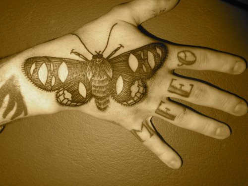 Moth Black Ink Tattoo On Right Hand