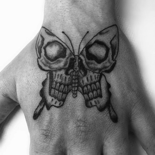 Left Hand Skull Grey Ink Moth Tattoo