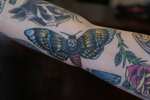 Grey Ink Skull Moth Tattoo On Arm