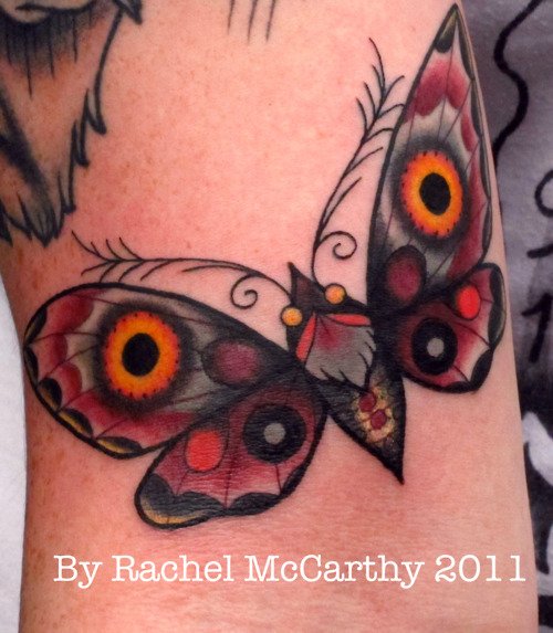 Colored Ink Bicep Moth Tattoo
