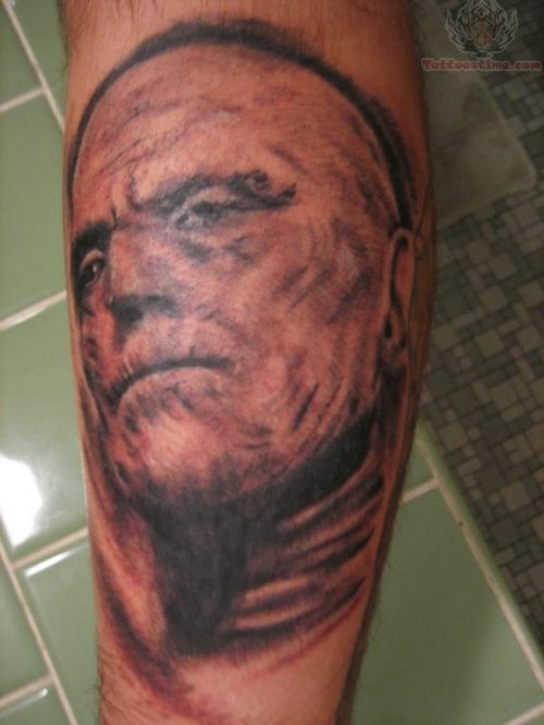 Mummy Face Tattoo On Arm