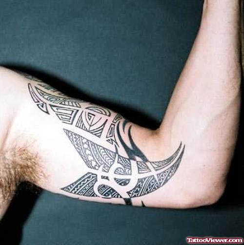 Tribal Design Tattoo On Muscle