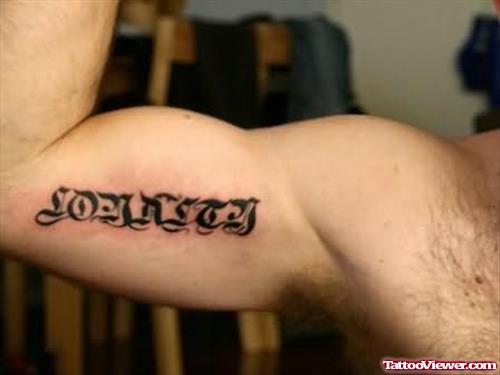 Wording Tattoo On Muscle