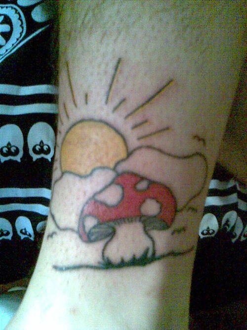 Sun And Red Mushroom Tattoo