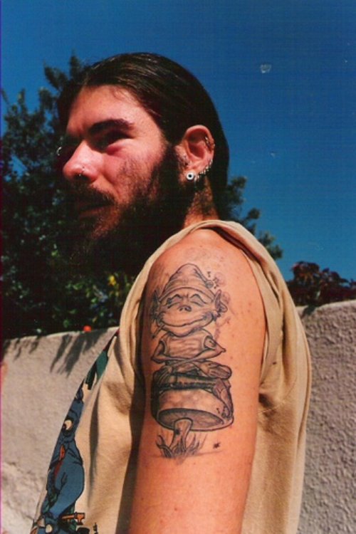 Grey Ink Goblin Sitting On Mushroom Tattoo On Half Sleeve