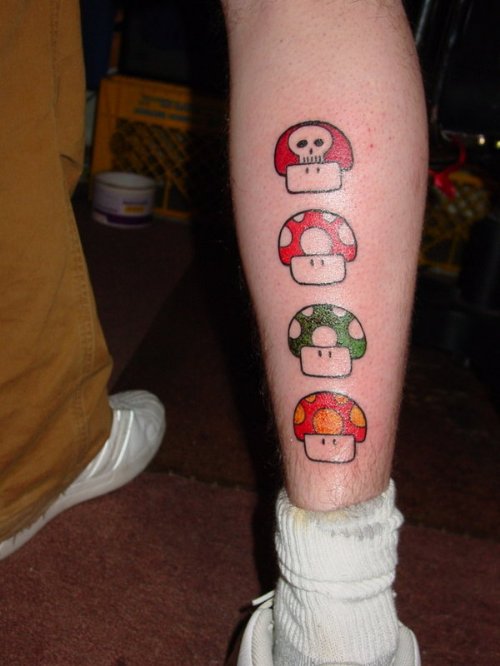Mario Mushrooms Colored Tattoos On Back Leg