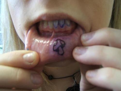 Mushroom Tattoo On Girl Lower Lip