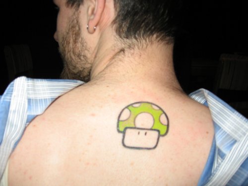 Mushroom Mario Green Ink Tattoo On Back