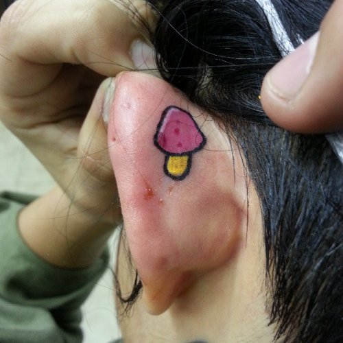 Mushroom Tattoo On Left Ear