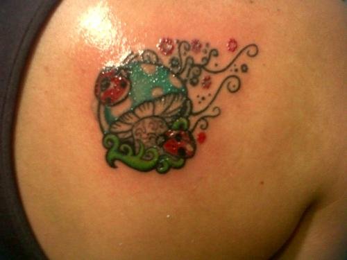 Lady Bug And Mushroom Green Ink Tattoo On Back Shoulder
