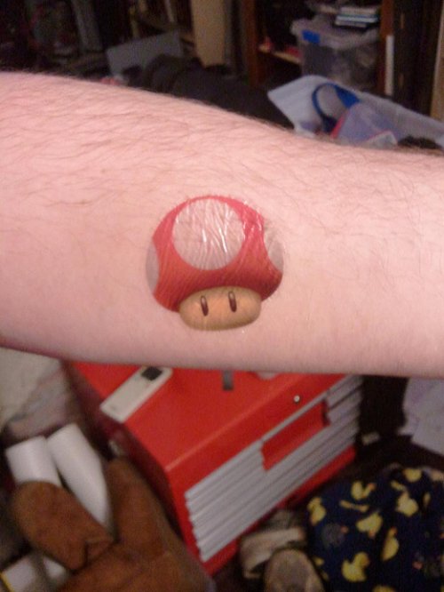 New Red Ink Mario Mushroom Tattoo On Arm