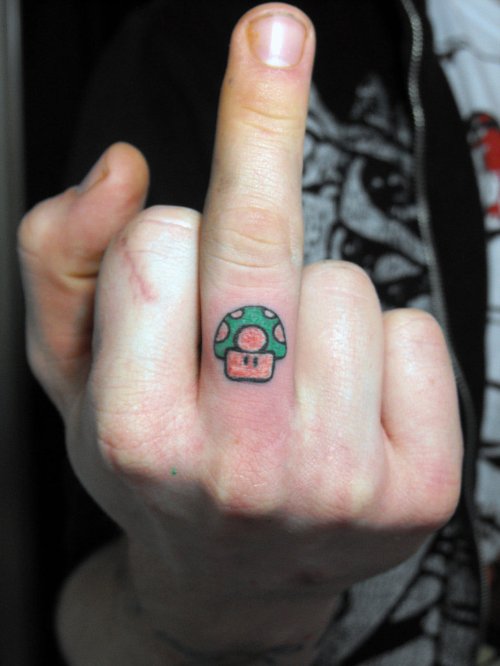 Mario One Up Mushroom Tattoo On Finger