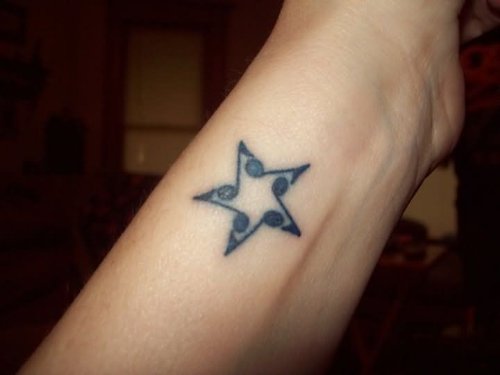 Black Star Music Tattoo On Wrist