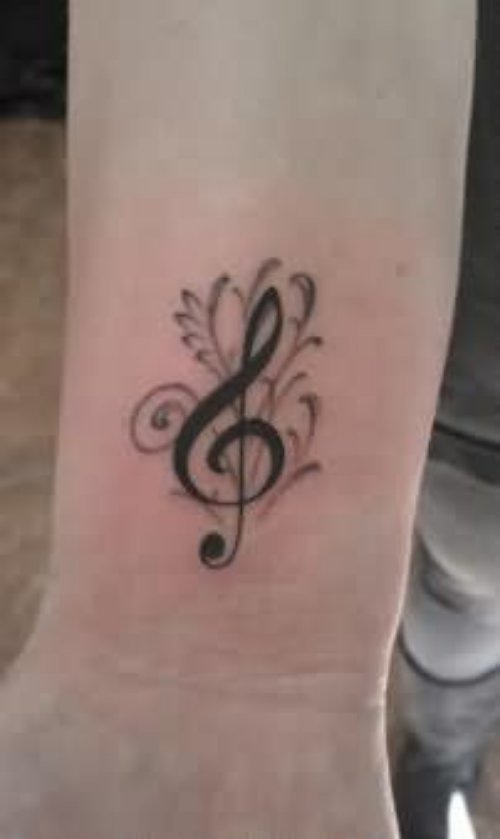 Black Ink Music Tattoo On Wrist