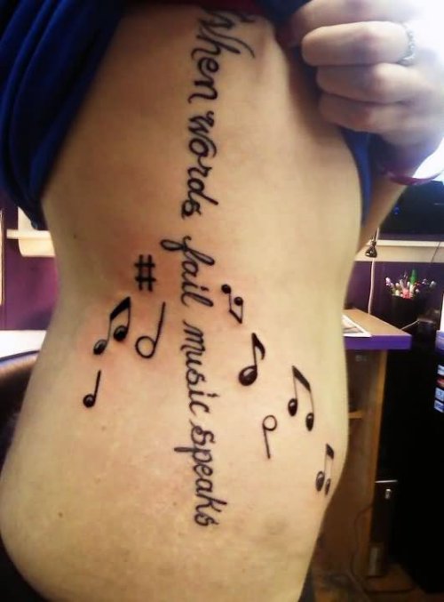 Rib Side Lettering and Music Tattoo