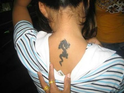 Premium Photo  The back of a girl with dragon tattoo