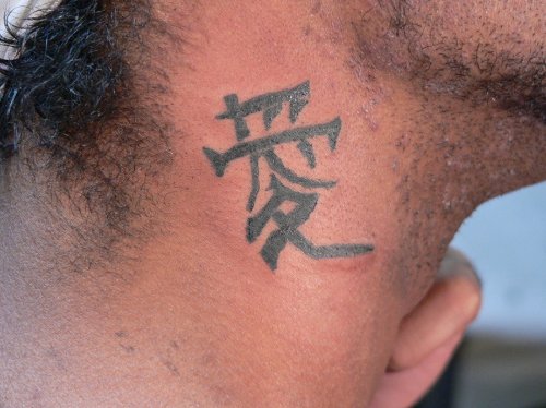 Attractive Chinese Symbol Side Neck Tattoo