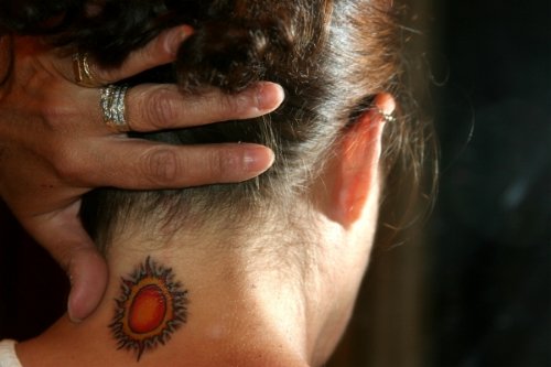 Glowing Sun Neck Tattoo For Girls