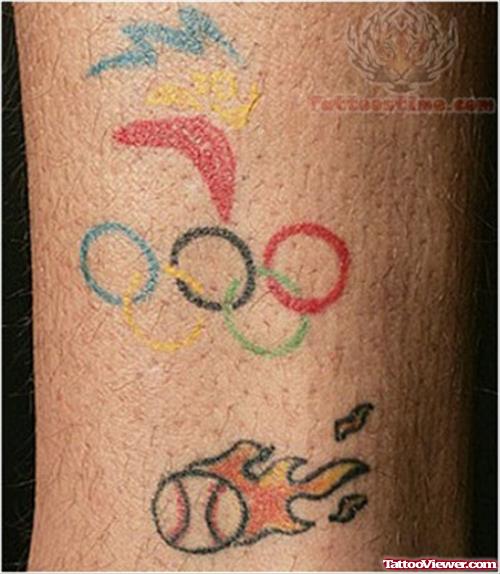 Olympic Rings And Flaming Ball Tattoo