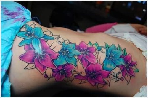 Colorful Orchid Tattoo On Left Rib Side