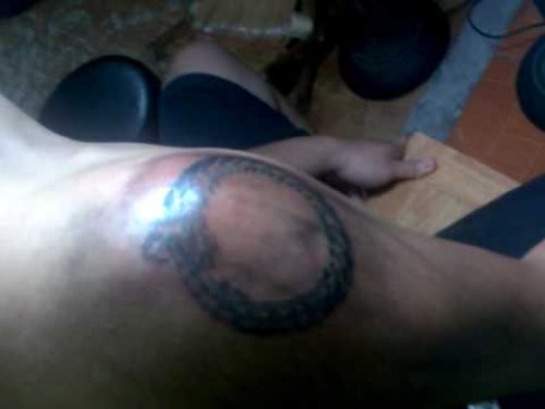 Ouroboros Tattoo On Man Shoulder