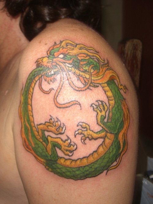Green Ink Ouroboros Tattoo On Left Shoulder