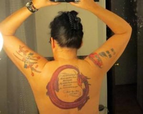 Attractive Red Ink Ouroboros Tattoo On Back