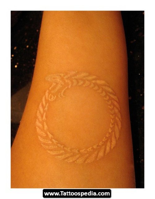 Beautiful White Ink Ouroboros Tattoo On Arm