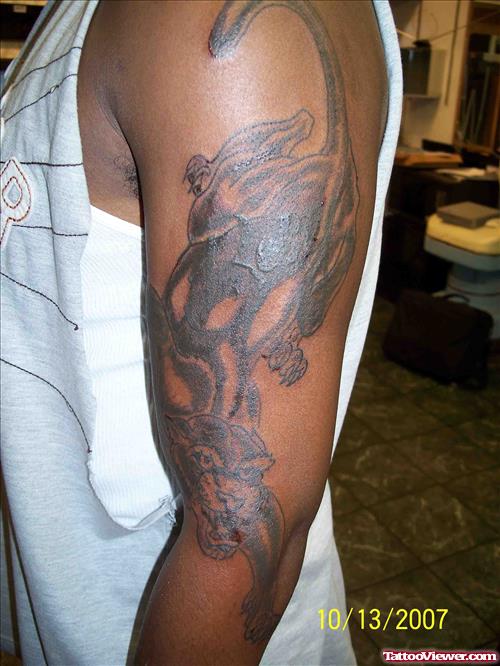 Man With Panther Tattoo On Left Sleeve