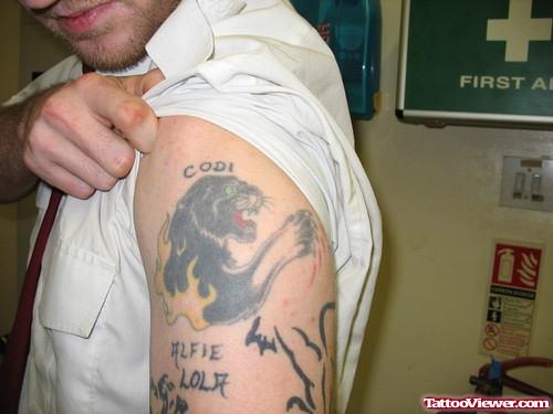 Man Showing Panther Tattoo On Left Half Sleeve