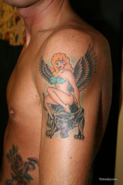 Pinup Girl With Angel Wings Sitting On Panther Tattoo