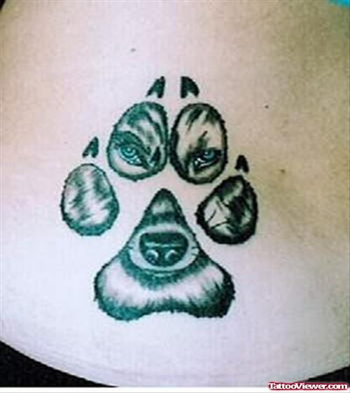 Wolf Face In Paw Print Tattoo