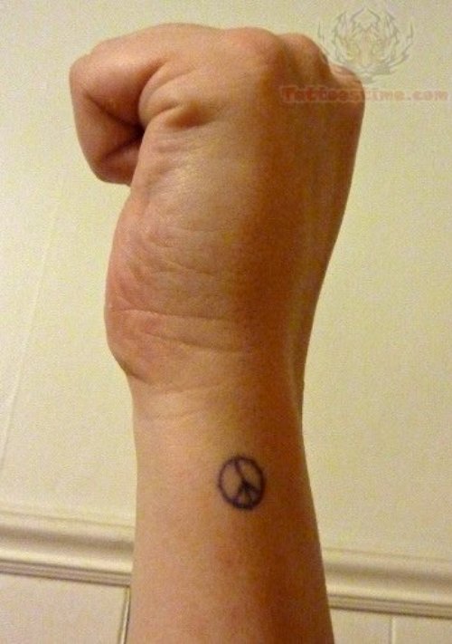 Tiny Peace Tattoo On Arm