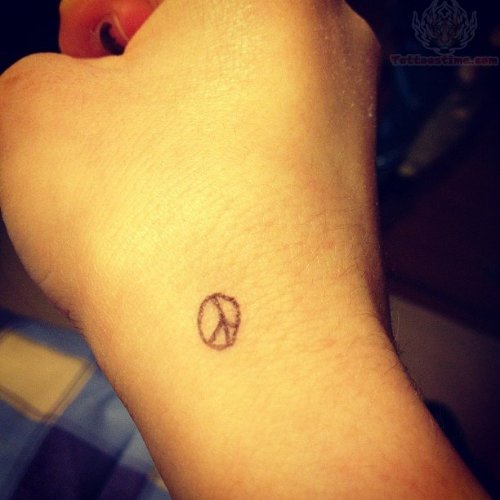 Tiny Peace Tattoo On Hand