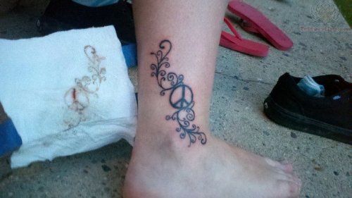 Peace Sign And Design Tattoo On Ankle