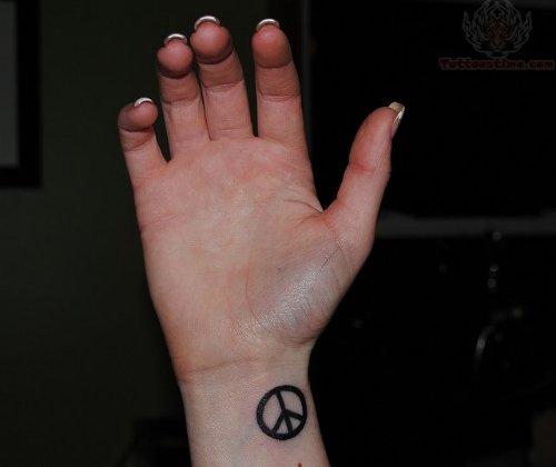Peace Tattoo On Girl Right Wrist