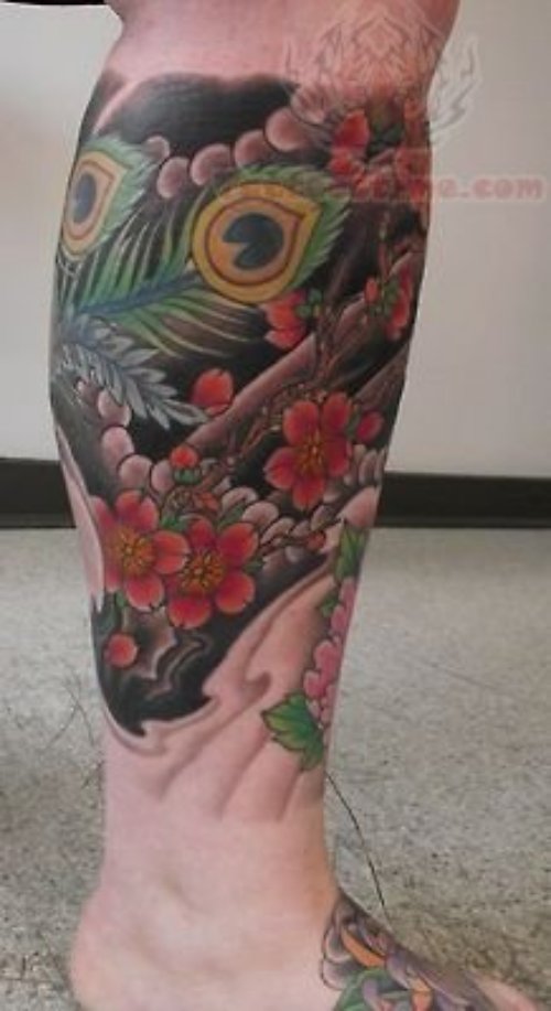 Color Flowers And Peacock Feather Tattoo On Leg