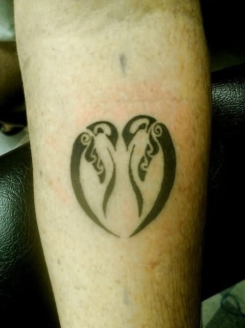 Tribal Penguins In Heart Shape Tattoo