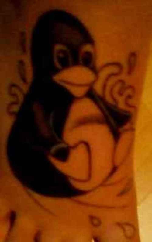 Black Ink Penguin Tattoo On Right Foot